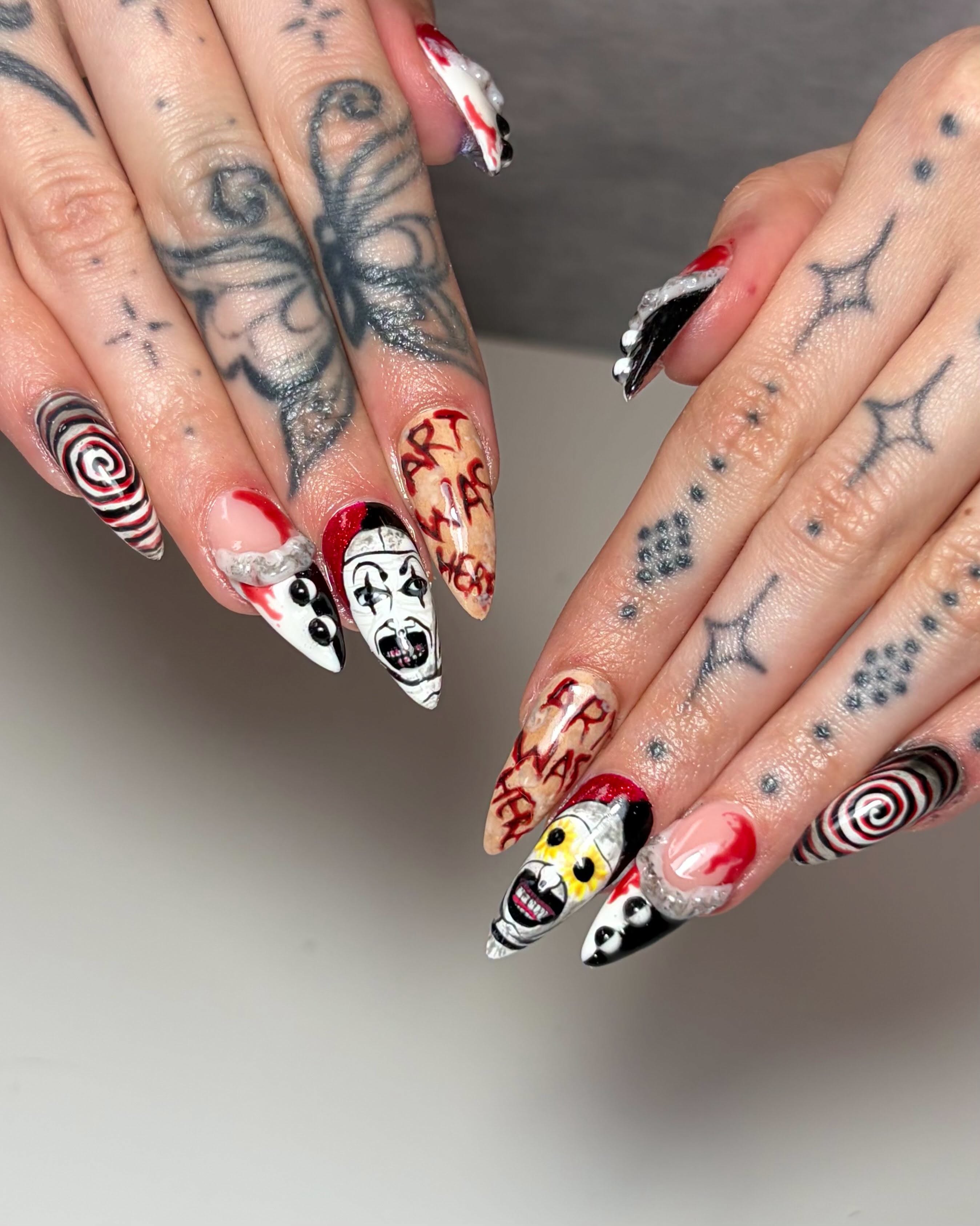 Intricate Halloween character nail art with spirals, lettering and a clown face