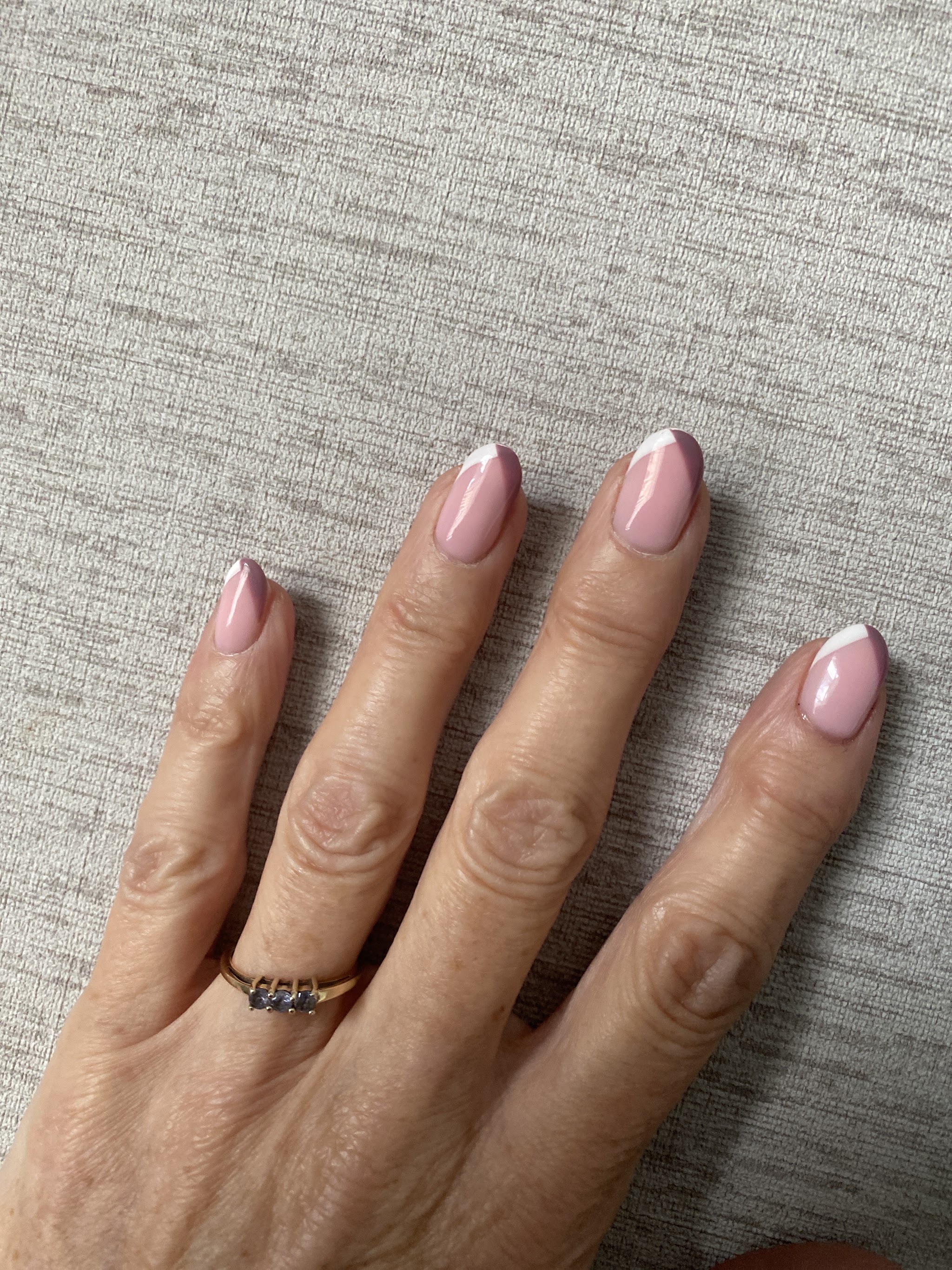 Natural nude nails with a silver chrome french tip
